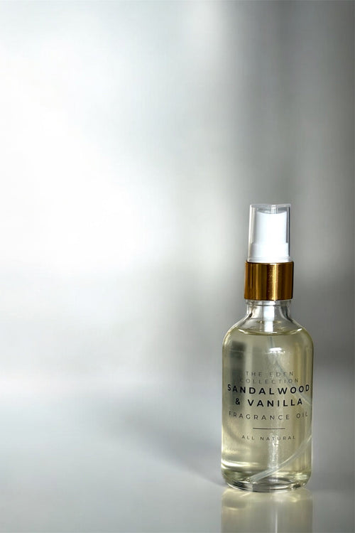 Sandalwood & Vanilla fragrance oil bottle on a reflective surface with a gradient background